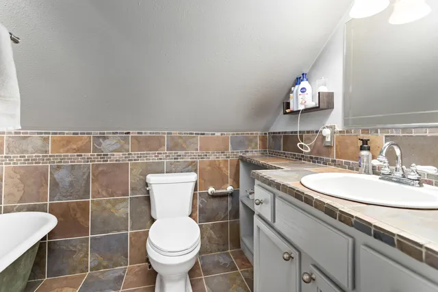 a bathroom with a sink and mirror