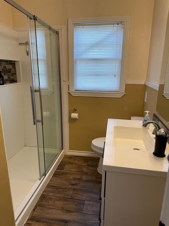 1716 Sheppard Street Waco, TX 76711 - Photo 11 of 13 a bathroom with a sink a toilet and shower
