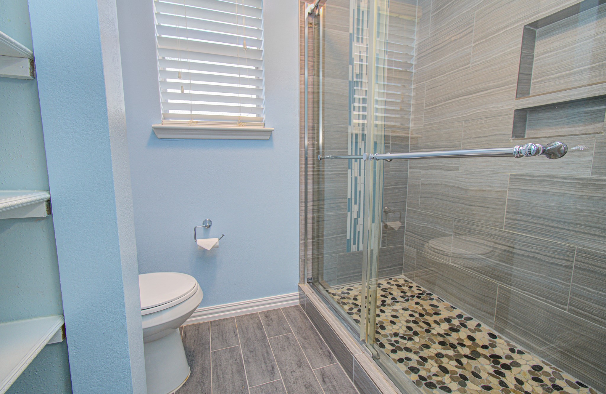 10546 Rippling Fields Drive Houston, TX 77064 - Photo 21 of 31 Primary bath with large shower with beautiful tile work.