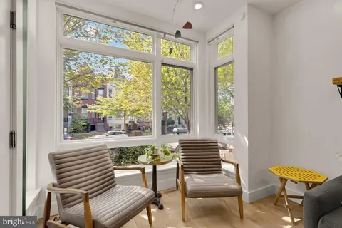 a bedroom with furniture and a window