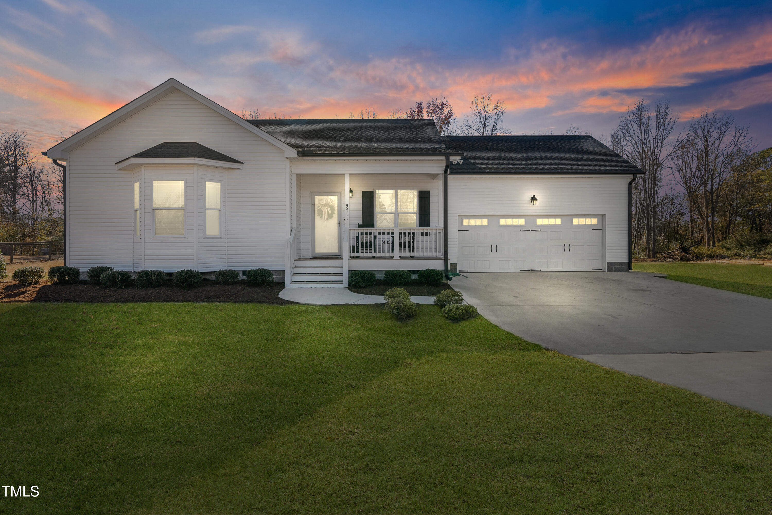 5711 Piney Grove Road Angier, NC 27501 - Photo 1 of 35 a front view of a house with a yard