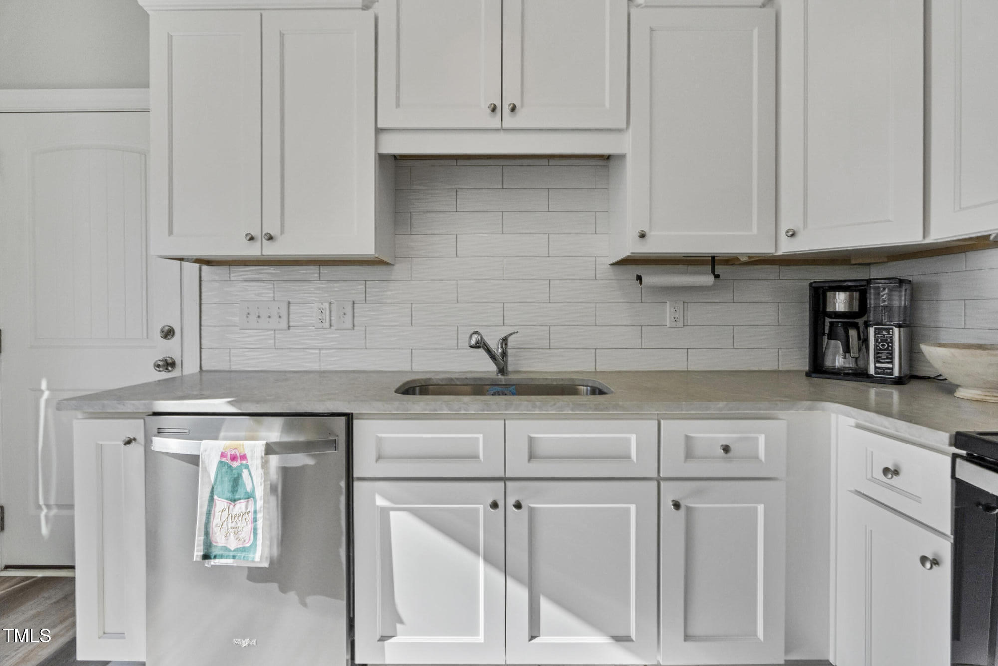 5711 Piney Grove Road Angier, NC 27501 - Photo 14 of 35 a kitchen with white cabinets and sink