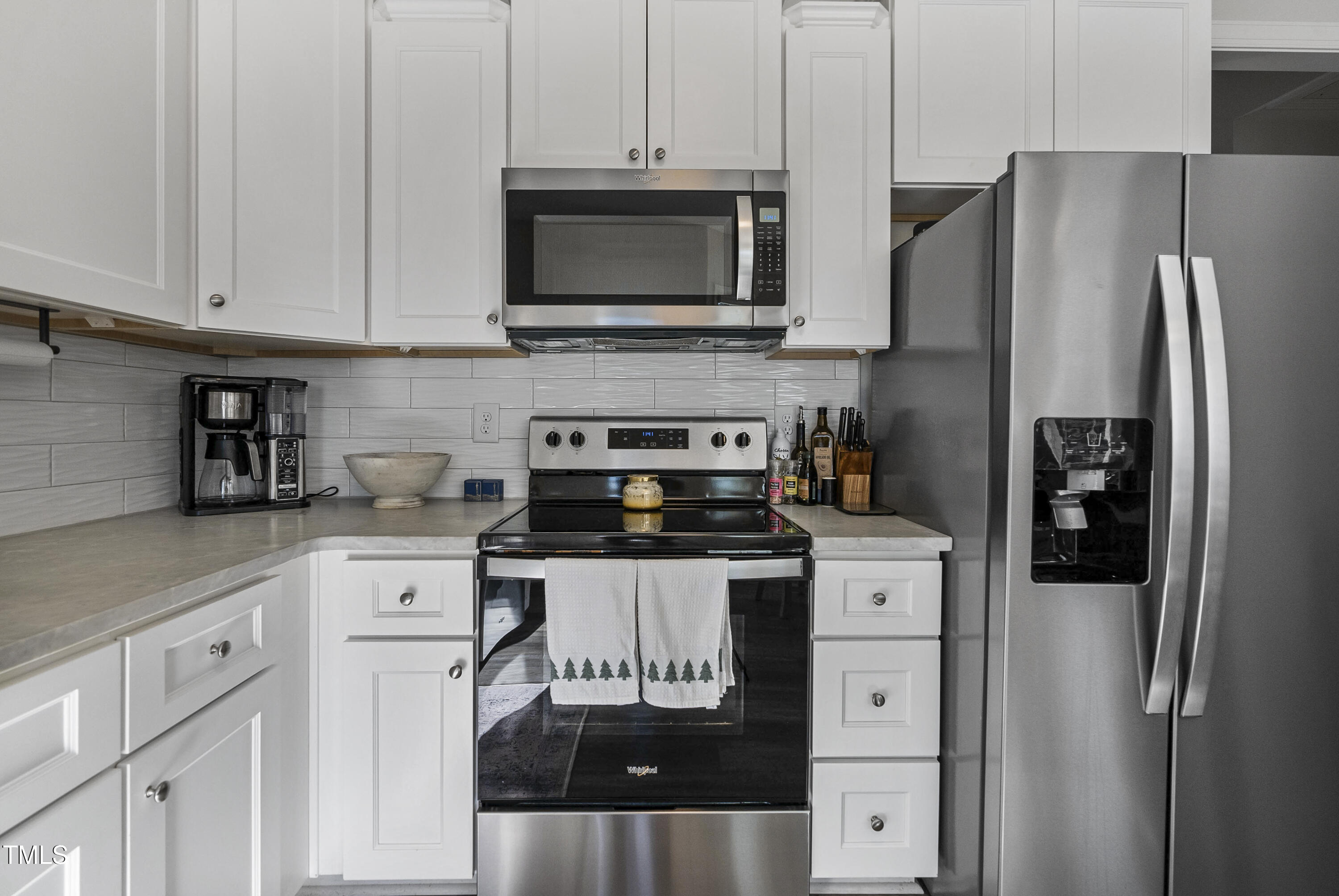 5711 Piney Grove Road Angier, NC 27501 - Photo 15 of 35 a kitchen with stainless steel appliances a refrigerator stove and microwave