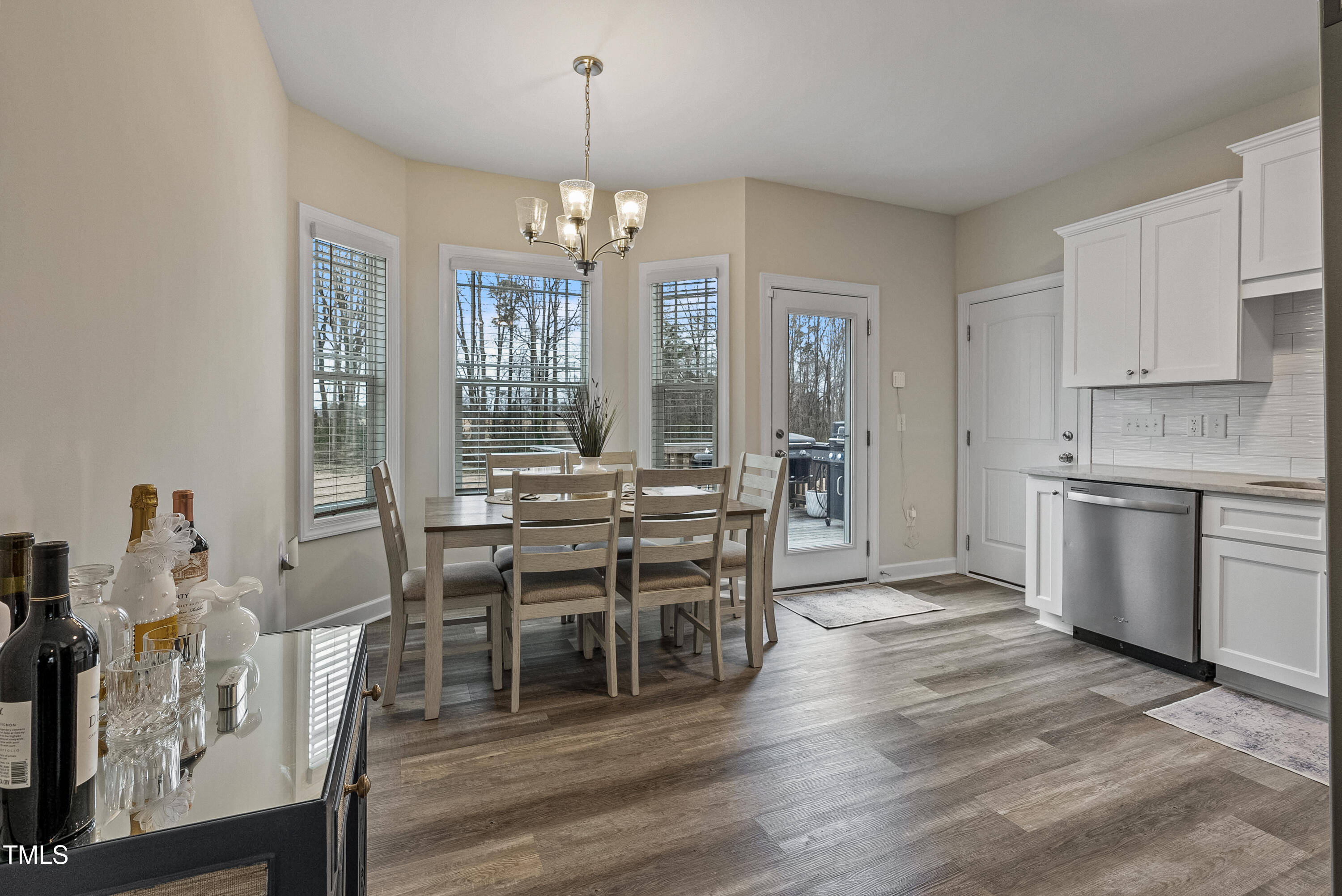 5711 Piney Grove Road Angier, NC 27501 - Photo 16 of 35 a view of a dining room with furniture window and wooden floor