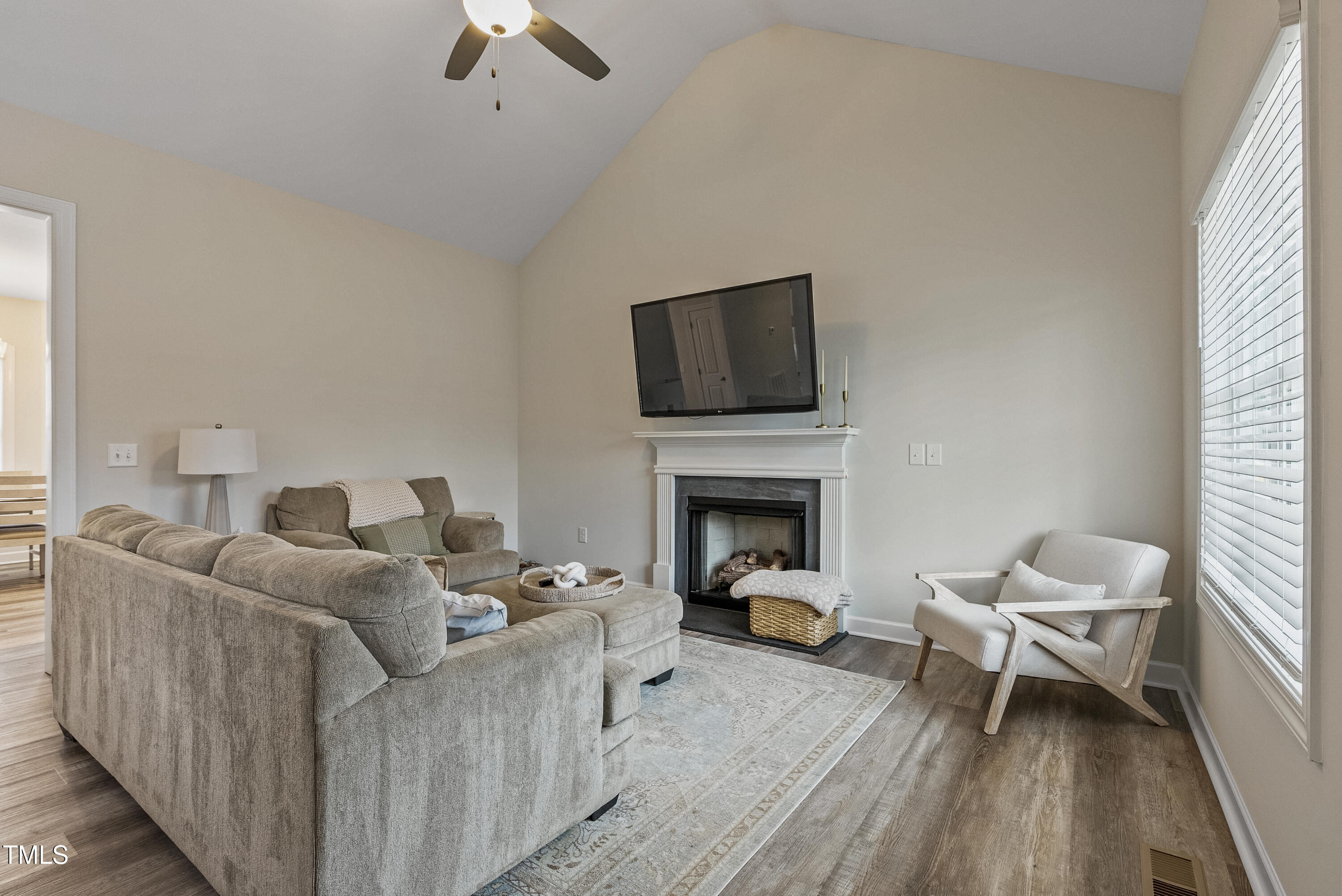 5711 Piney Grove Road Angier, NC 27501 - Photo 18 of 35 a living room with furniture and a fireplace