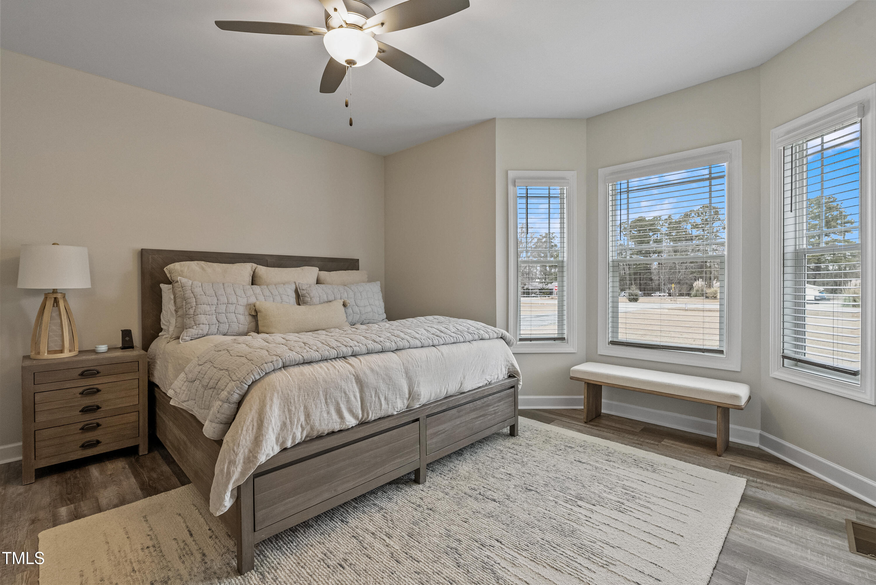 5711 Piney Grove Road Angier, NC 27501 - Photo 20 of 35 a bedroom with a large bed and a window