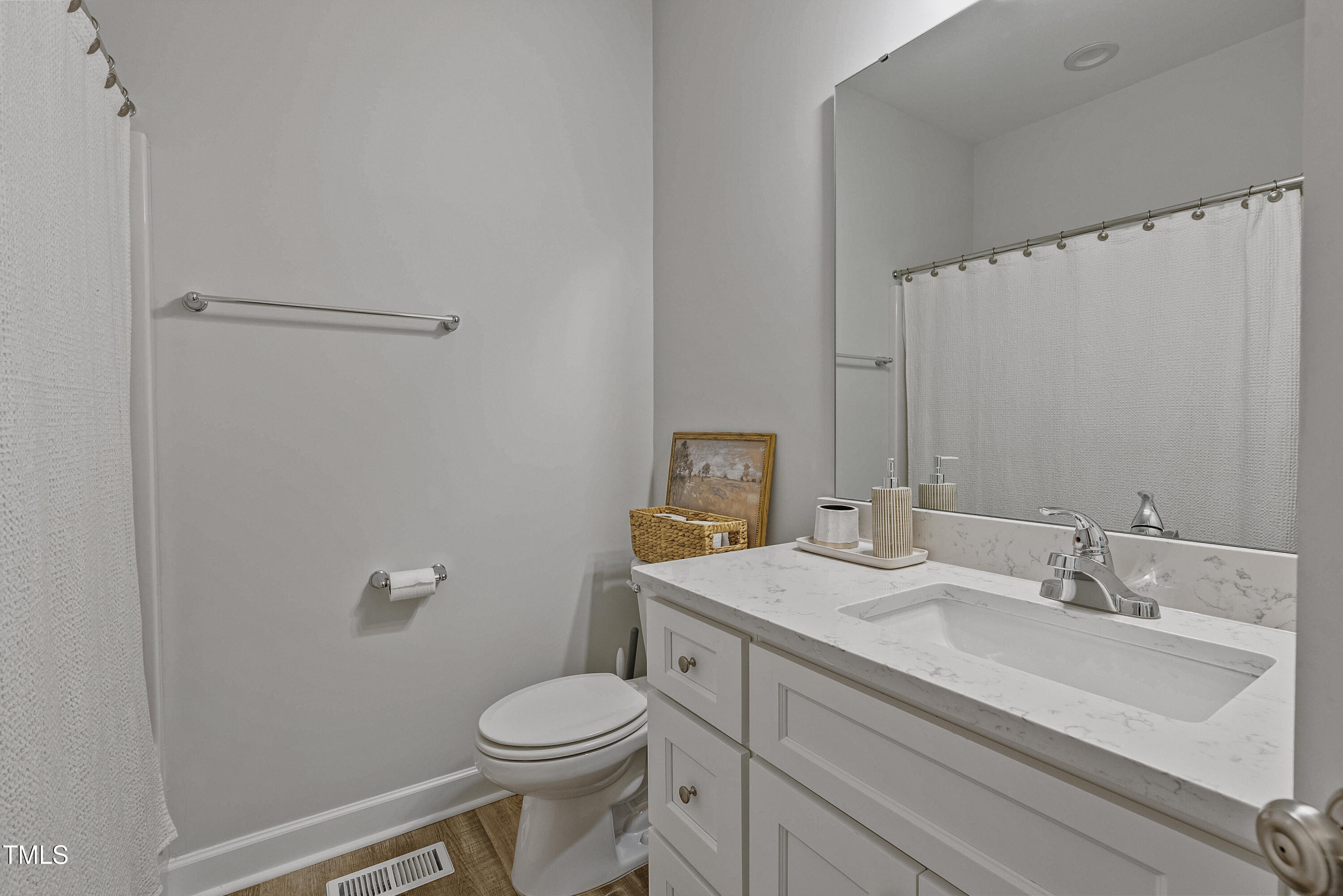 5711 Piney Grove Road Angier, NC 27501 - Photo 27 of 35 a bathroom with a sink a toilet and shower