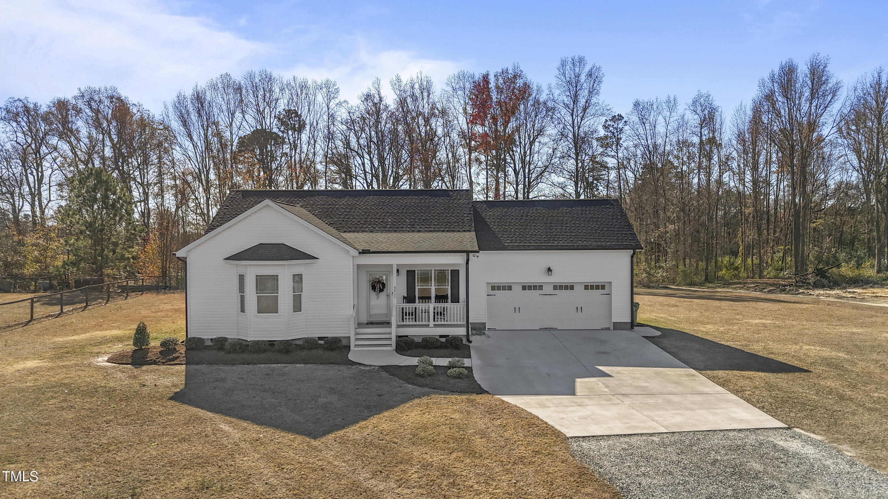 5711 Piney Grove Road Angier, NC 27501 - Photo 3 of 35 a view of a house with a yard covered in snow