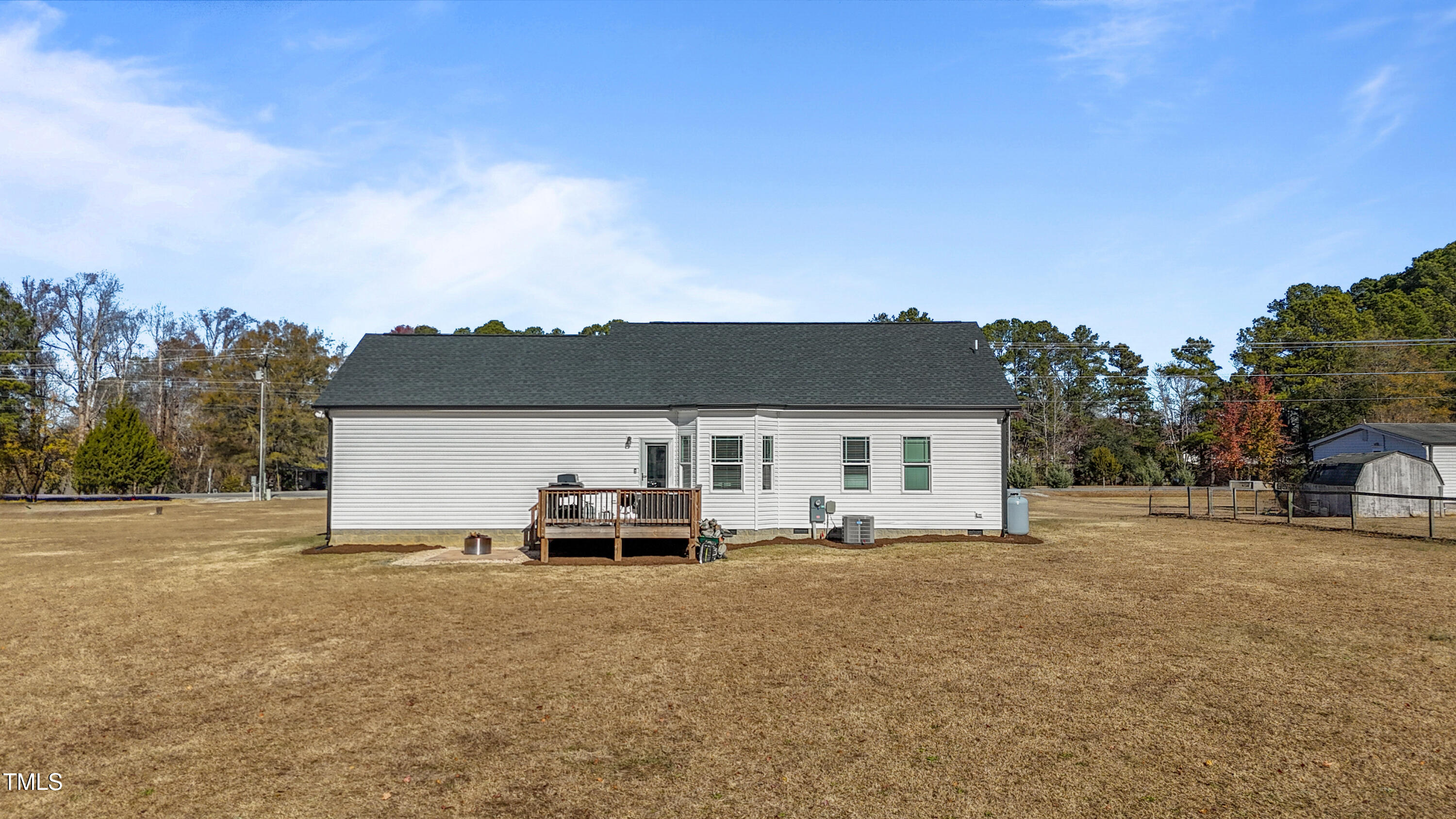 5711 Piney Grove Road Angier, NC 27501 - Photo 31 of 35 a car parked in front of house with a yard