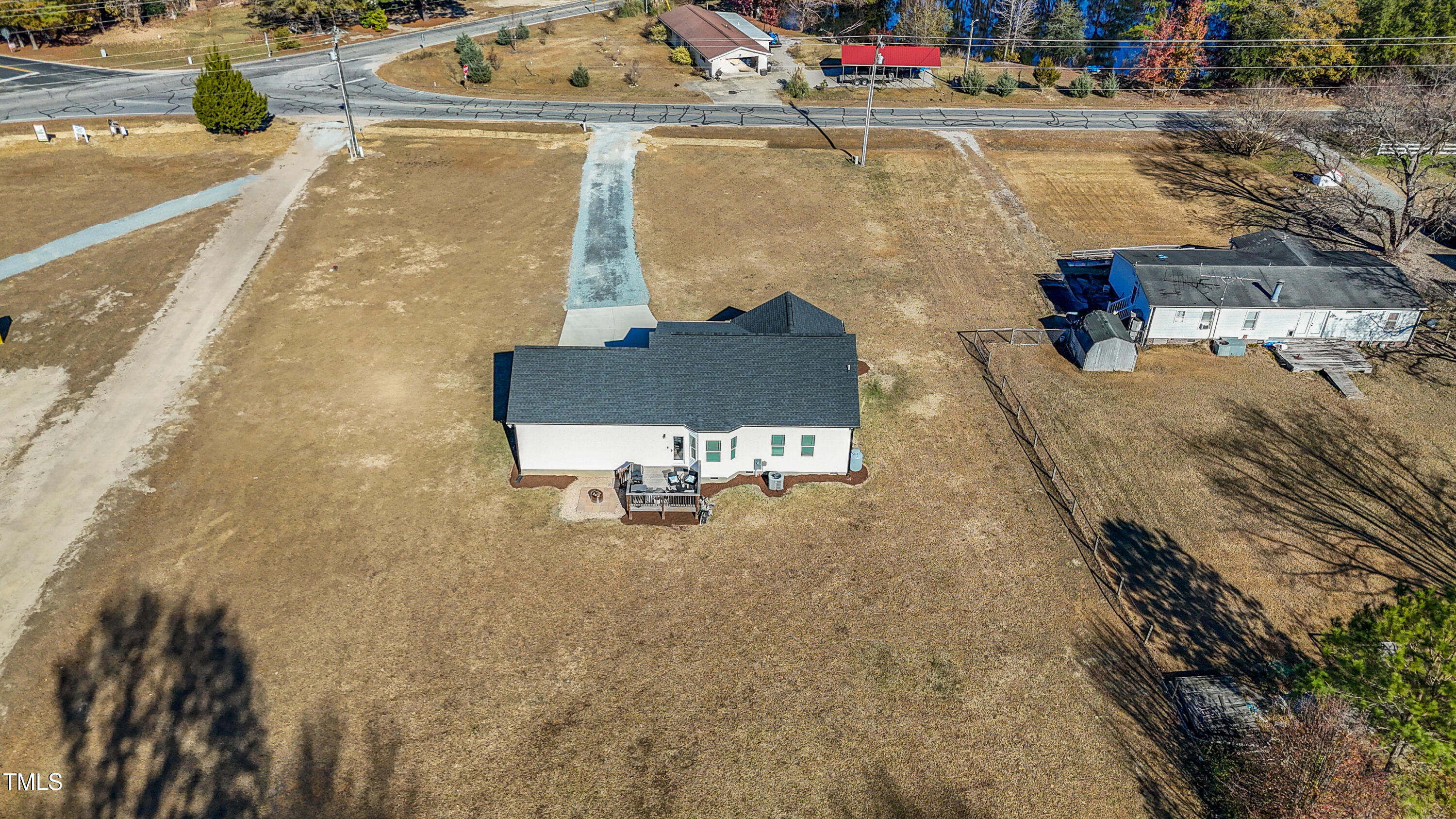 5711 Piney Grove Road Angier, NC 27501 - Photo 32 of 35 an aerial view of a house with a yard basket ball court and outdoor seating