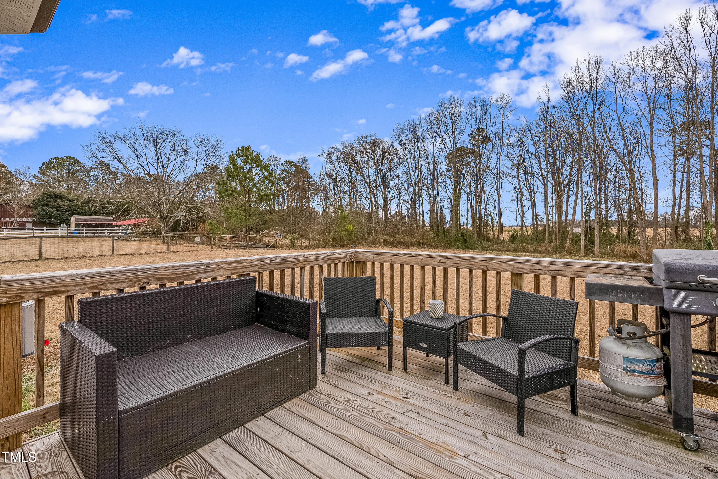 5711 Piney Grove Road Angier, NC 27501 - Photo 35 of 35 a view of balcony with wooden floor and outdoor seating