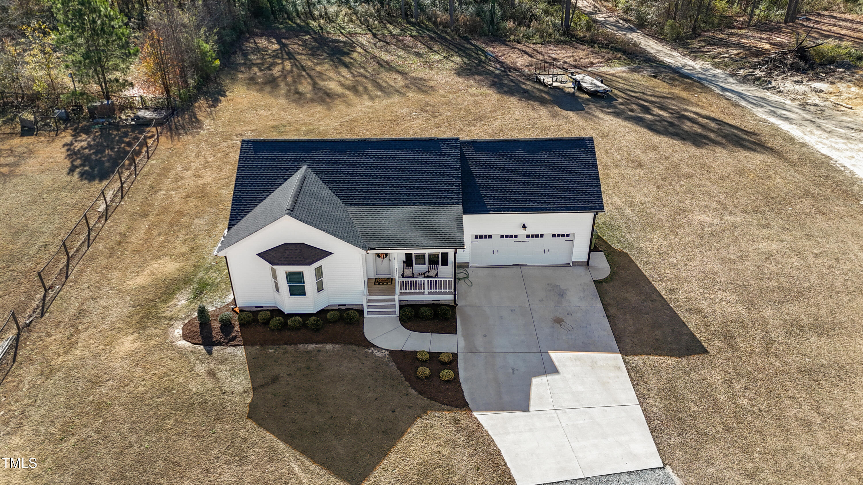 5711 Piney Grove Road Angier, NC 27501 - Photo 4 of 35 an aerial view of a house with large trees