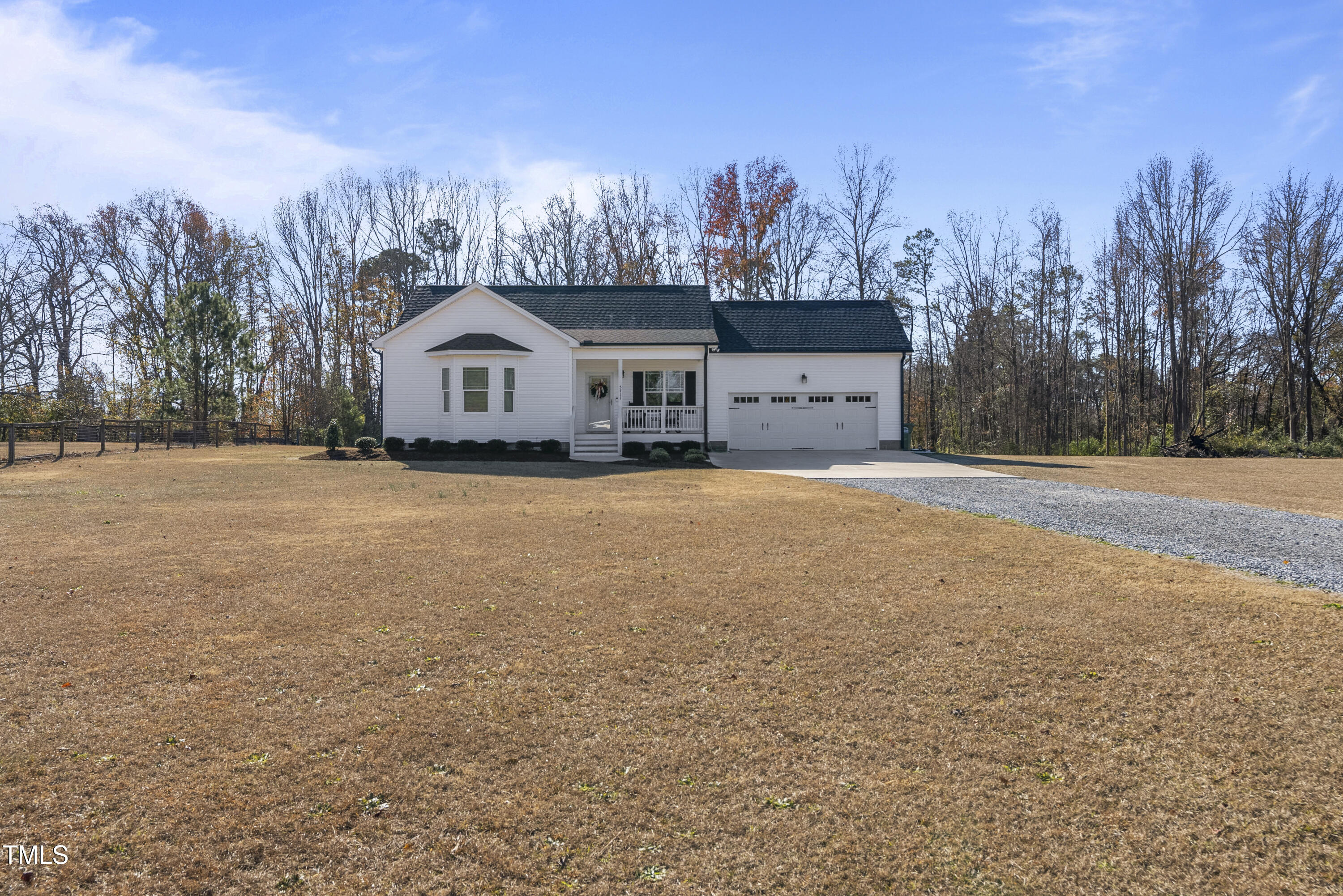 5711 Piney Grove Road Angier, NC 27501 - Photo 6 of 35 a view of a house with a yard and large trees