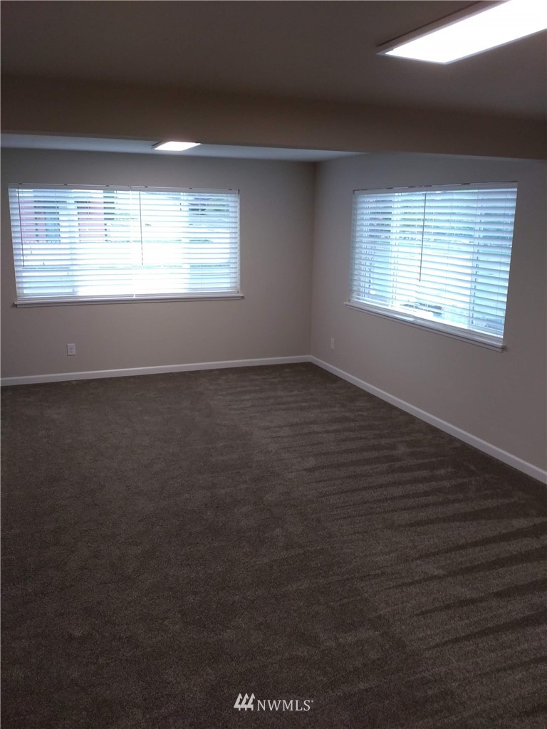 1141-1143 Magnuson Way Bremerton, WA 98310 - Photo 8 of 10 a view of an empty room with a window