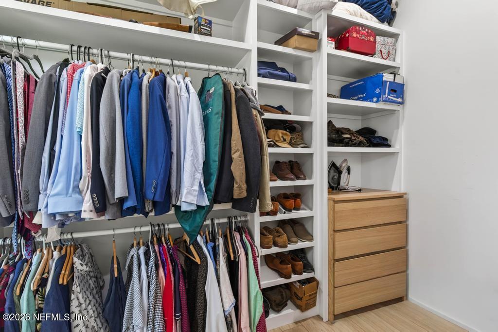 2955 Carroll Corner Road Hilliard, FL 32046 - Photo 64 of 106 a view of walk in closet with clothes and shoes