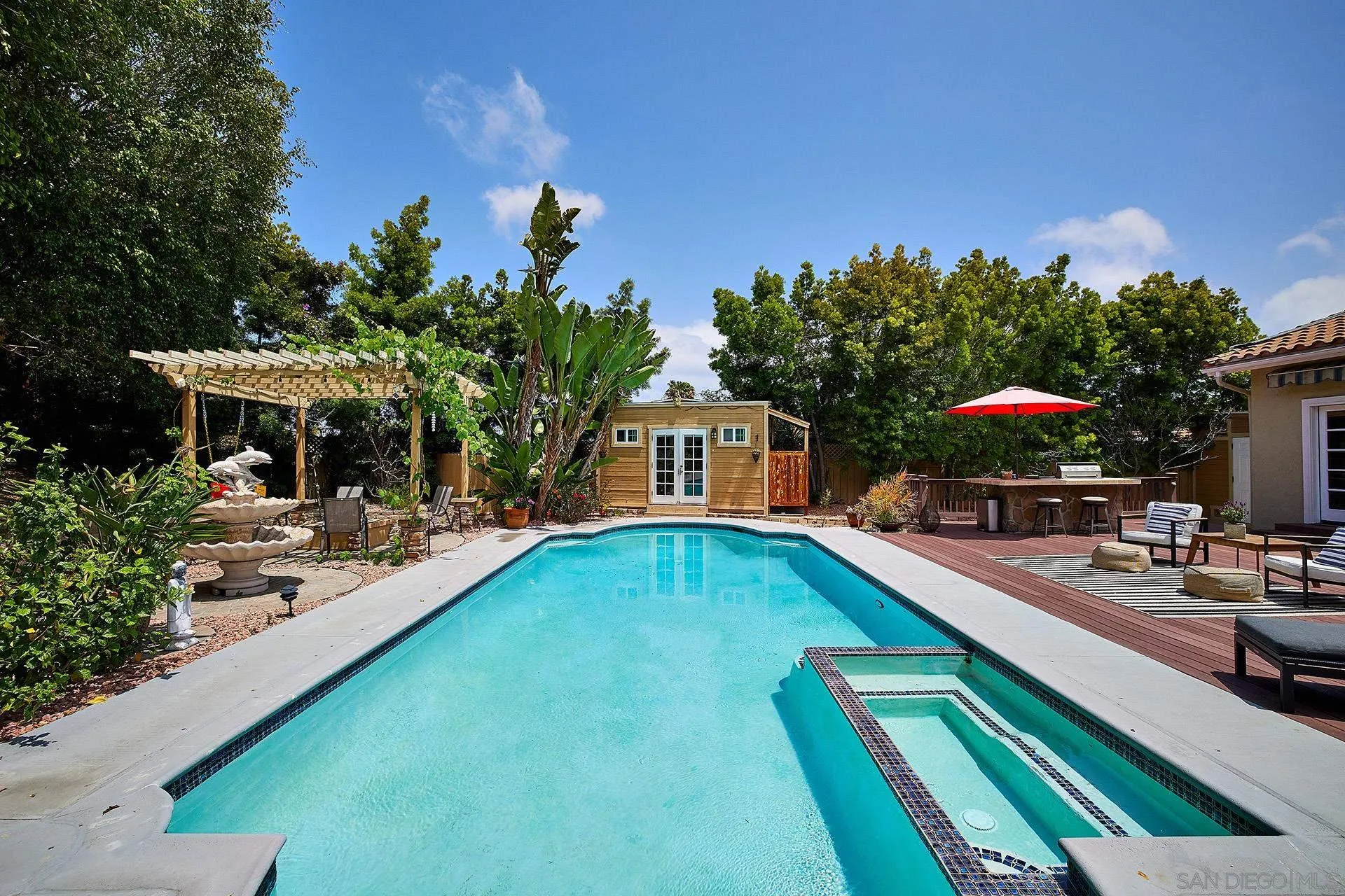 a view of a swimming pool with a lounge chairs