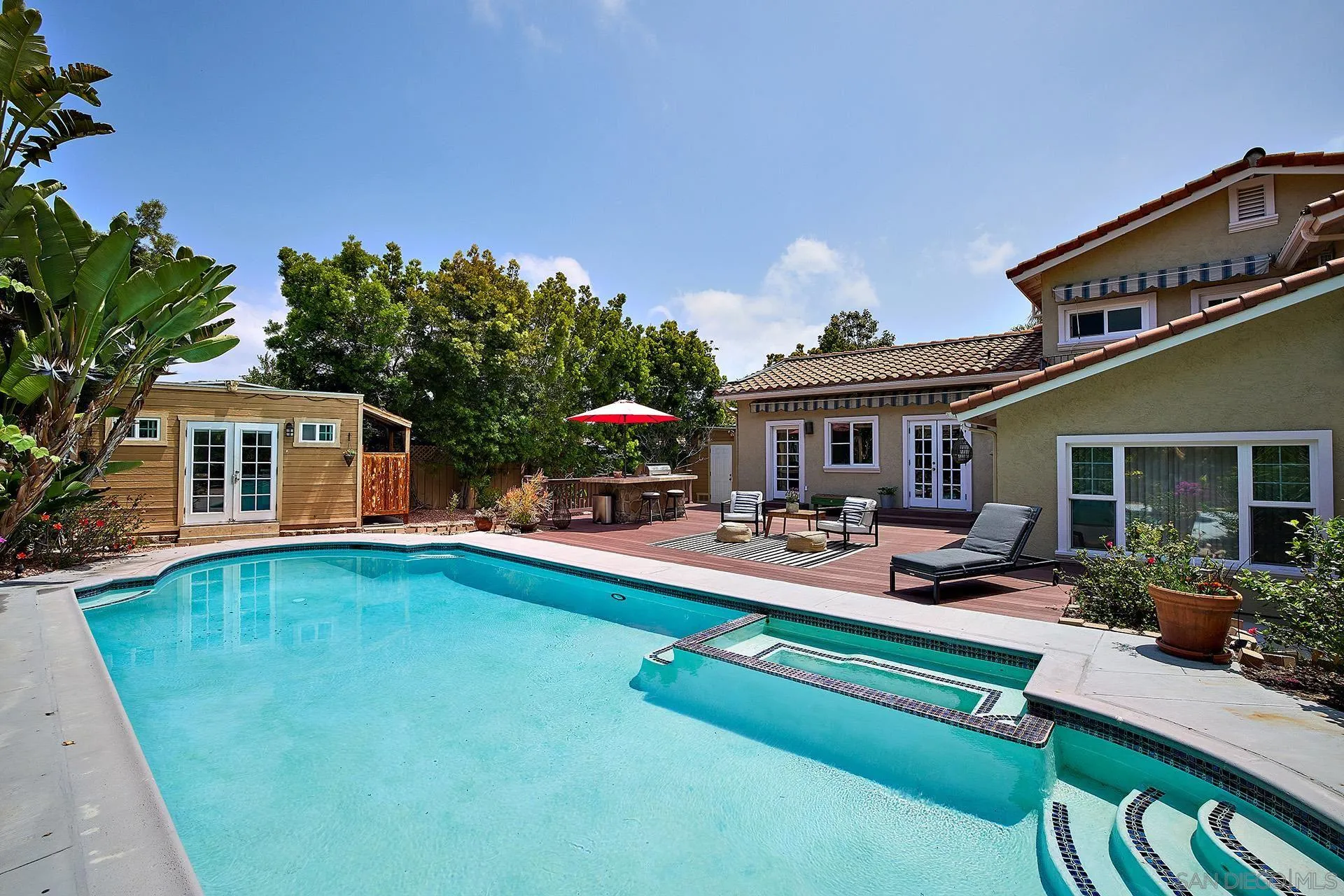 1548 Calle Violetas Encinitas, CA 92024 - Photo 11 of 47 a front view of a house with swimming pool having outdoor seating