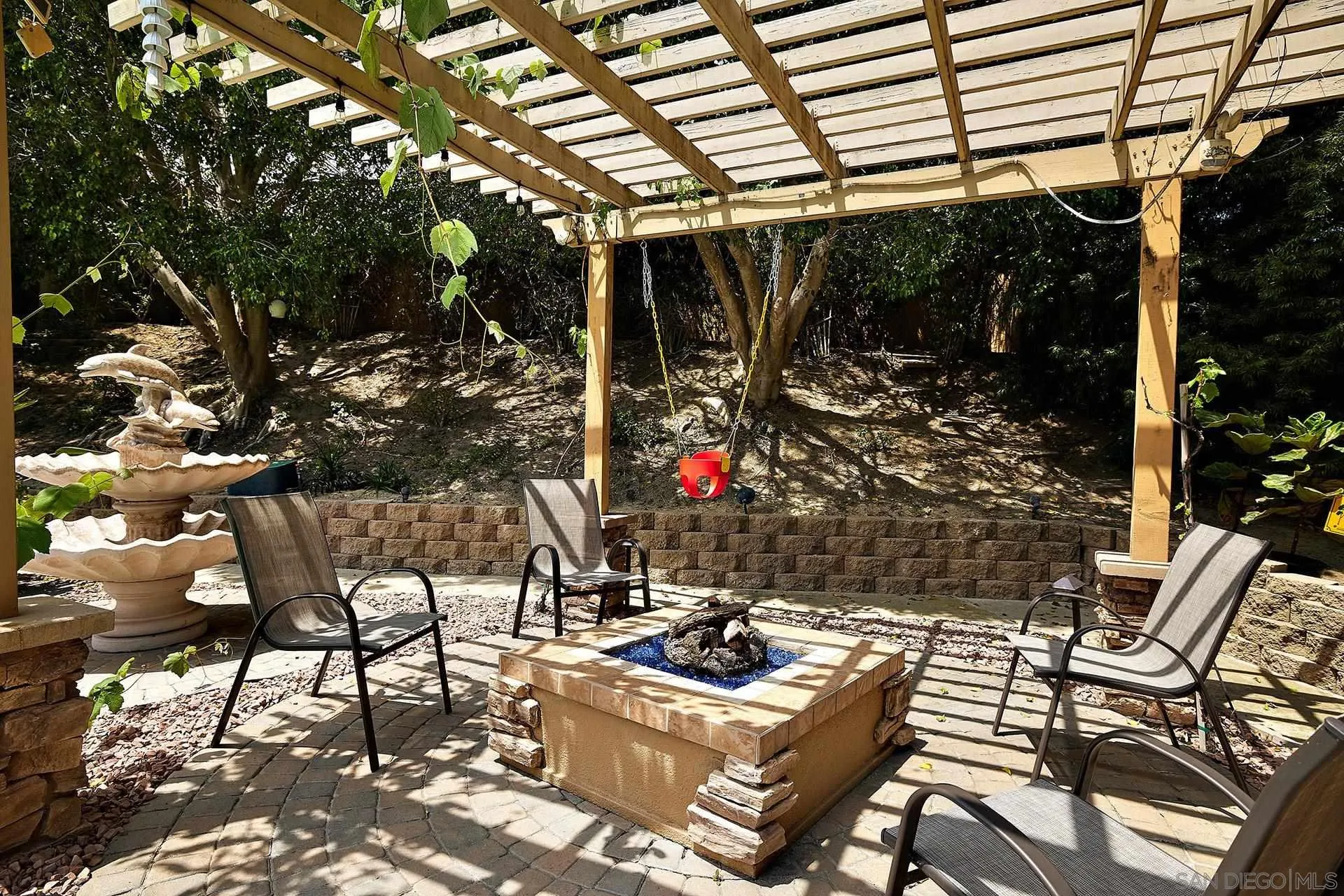 1548 Calle Violetas Encinitas, CA 92024 - Photo 14 of 47 a view of a patio with table and chairs and potted plants