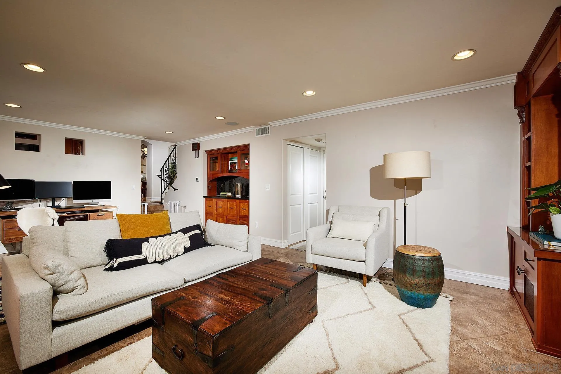 1548 Calle Violetas Encinitas, CA 92024 - Photo 20 of 47 a living room with furniture a flat screen tv and a lamp