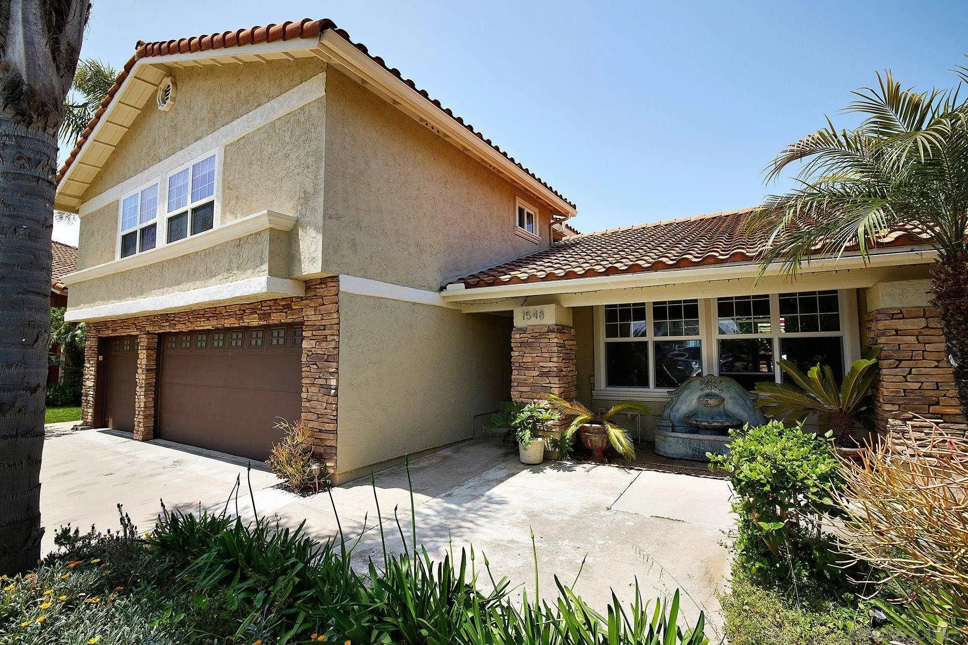 1548 Calle Violetas Encinitas, CA 92024 - Photo 2 of 47 a front view of a house with garden