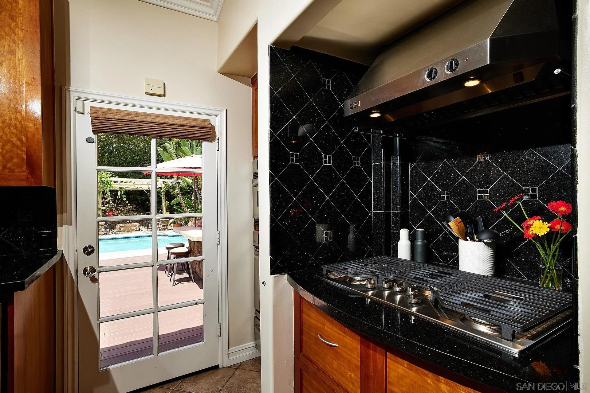 1548 Calle Violetas Encinitas, CA 92024 - Photo 22 of 47 a kitchen with a stove and a cabinet