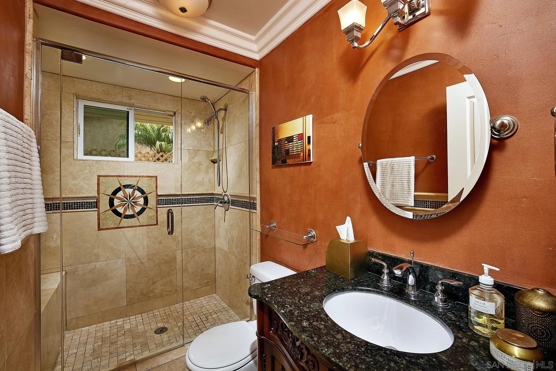 1548 Calle Violetas Encinitas, CA 92024 - Photo 25 of 47 a bathroom with a sink mirror a toilet and a mirror