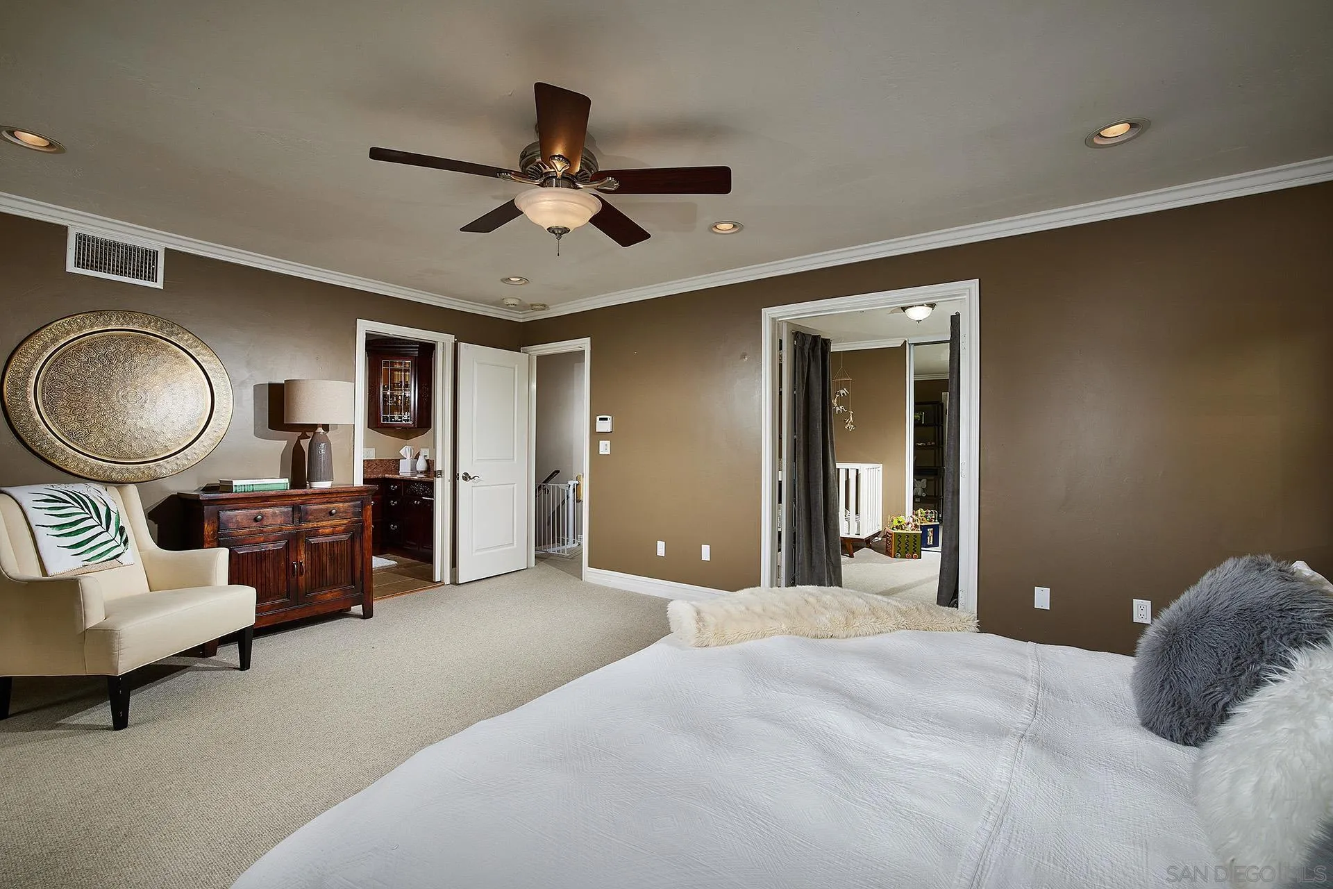 1548 Calle Violetas Encinitas, CA 92024 - Photo 27 of 47 a bedroom with a bed couch and dresser