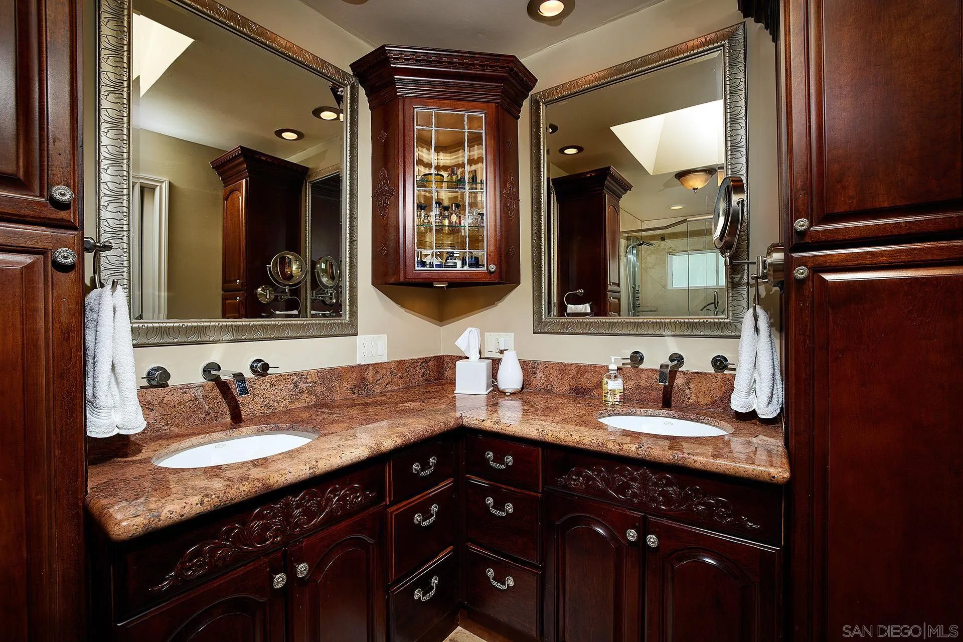1548 Calle Violetas Encinitas, CA 92024 - Photo 30 of 47 a bathroom with a granite countertop double vanity sink and a mirror