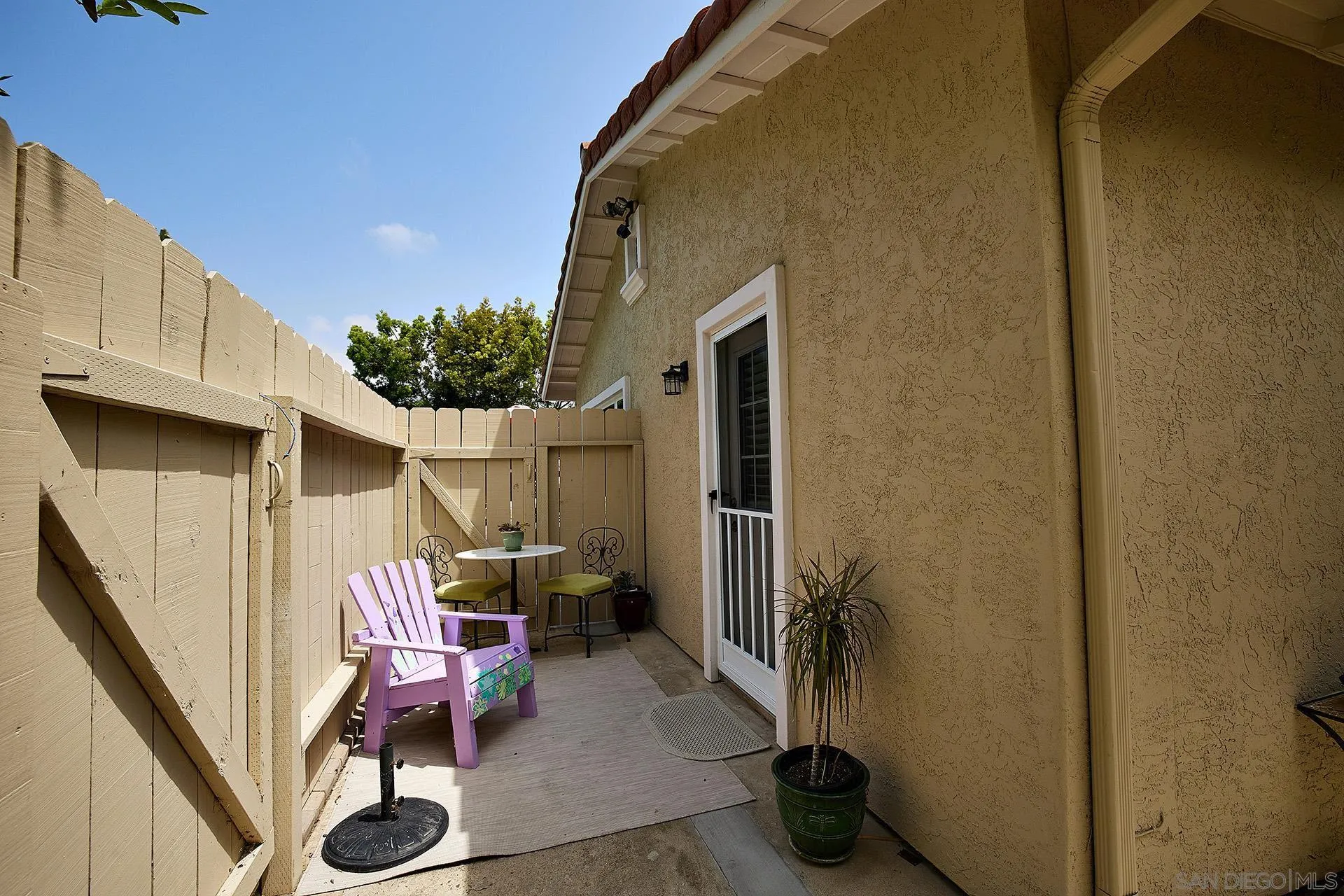 1548 Calle Violetas Encinitas, CA 92024 - Photo 35 of 47 a view of a porch with furniture and a gate