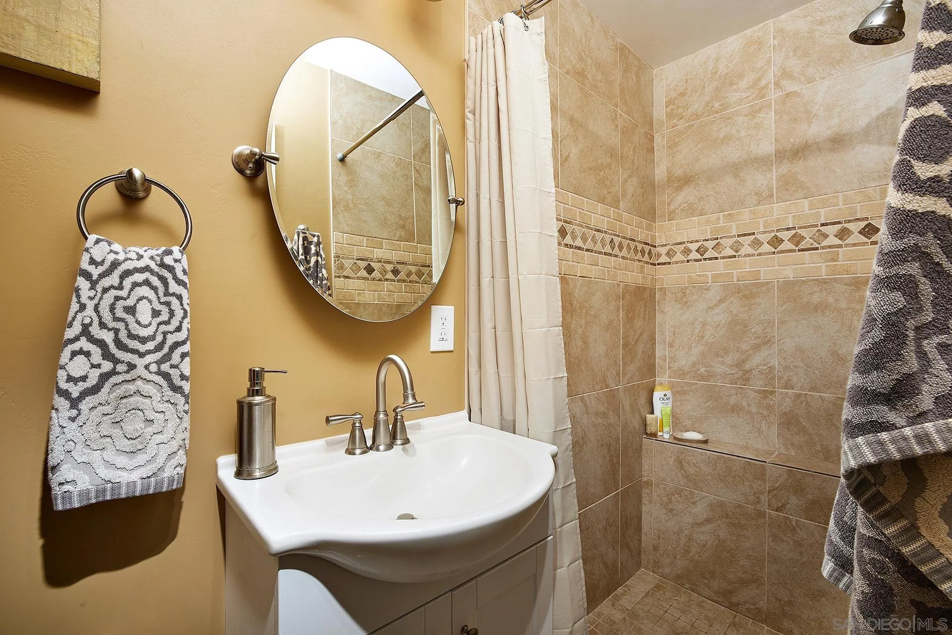 1548 Calle Violetas Encinitas, CA 92024 - Photo 40 of 47 a bathroom with a sink and mirror