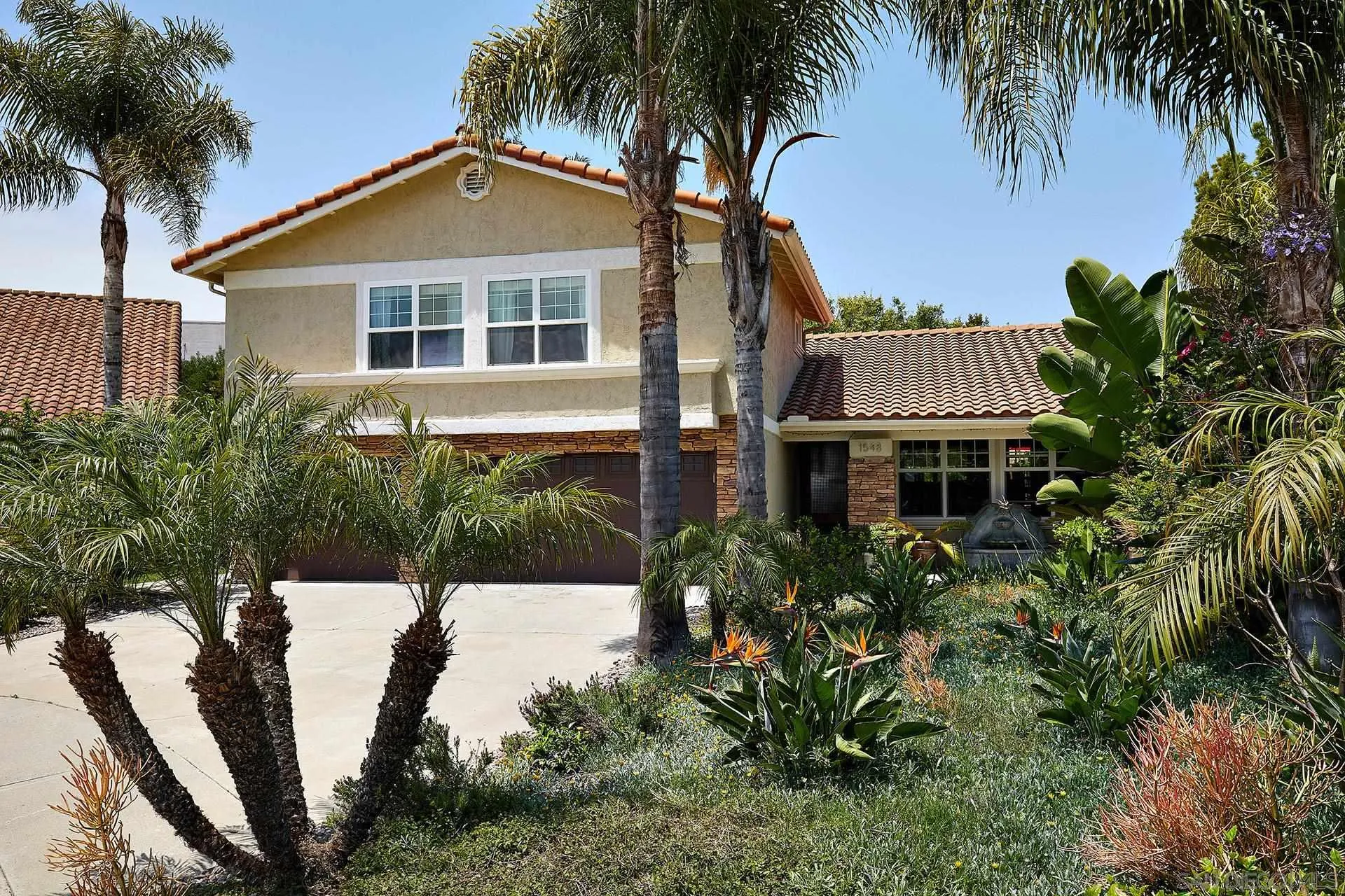 1548 Calle Violetas Encinitas, CA 92024 - Photo 4 of 47 a front view of a house with a garden