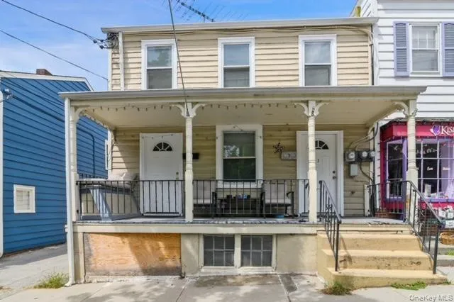 a front view of a house with a porch