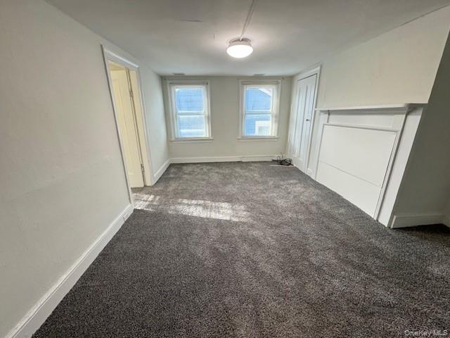 70 Main Street, Unit 2 Cold Spring, NY 10516 - Photo 5 of 9 an empty room with windows