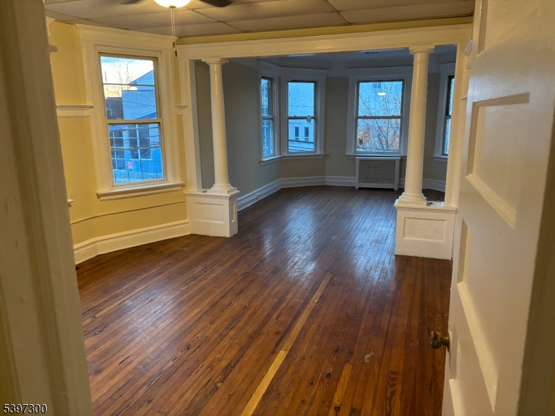 100 Harrison Place, Unit 3 Irvington, NJ 07111 - Photo 4 of 17 a view of an entryway with wooden floor
