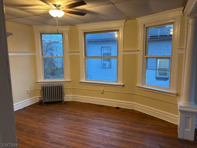 100 Harrison Place, Unit 3 Irvington, NJ 07111 - Photo 6 of 17 a view of front door with wooden floor