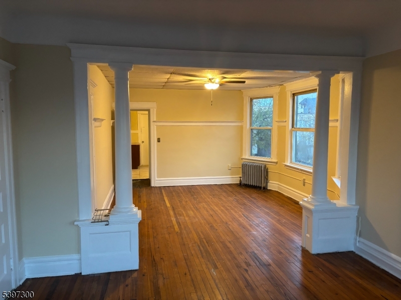 100 Harrison Place, Unit 3 Irvington, NJ 07111 - Photo 7 of 17 a view of front door with wooden floor and door