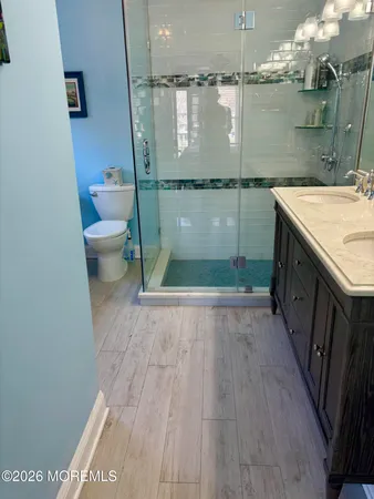 a view of bathroom with a sink and toilet