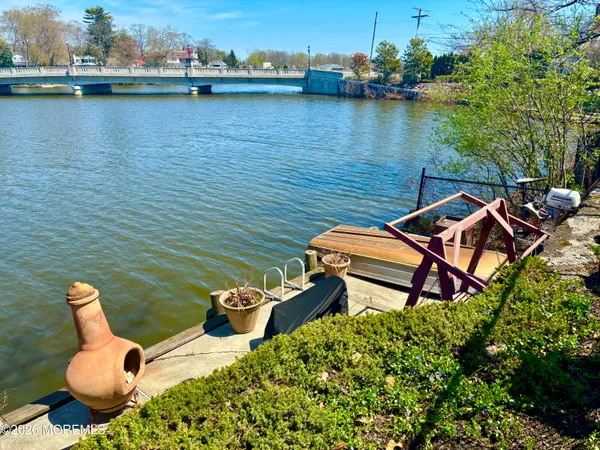 an aerial view of a house with outdoor seating