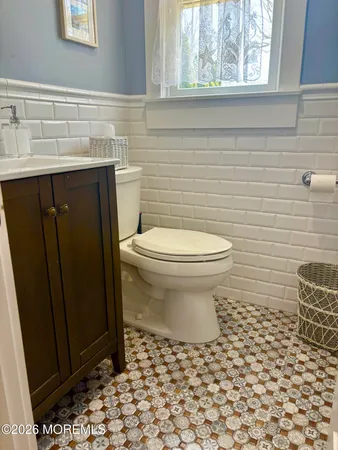 a bathroom with a toilet and a sink