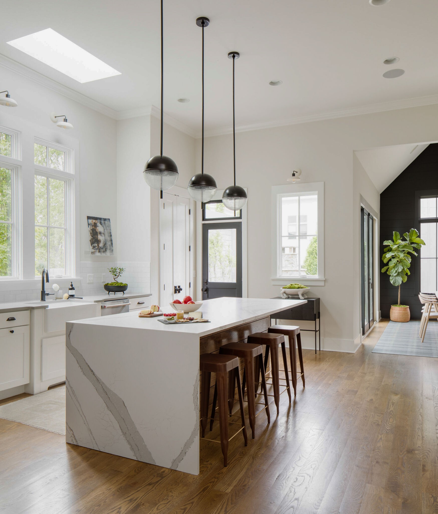 853 B Bradford Avenue Nashville, TN 37204 - Photo 11 of 49 a kitchen with stainless steel appliances granite countertop a table chairs stove a sink and dishwasher