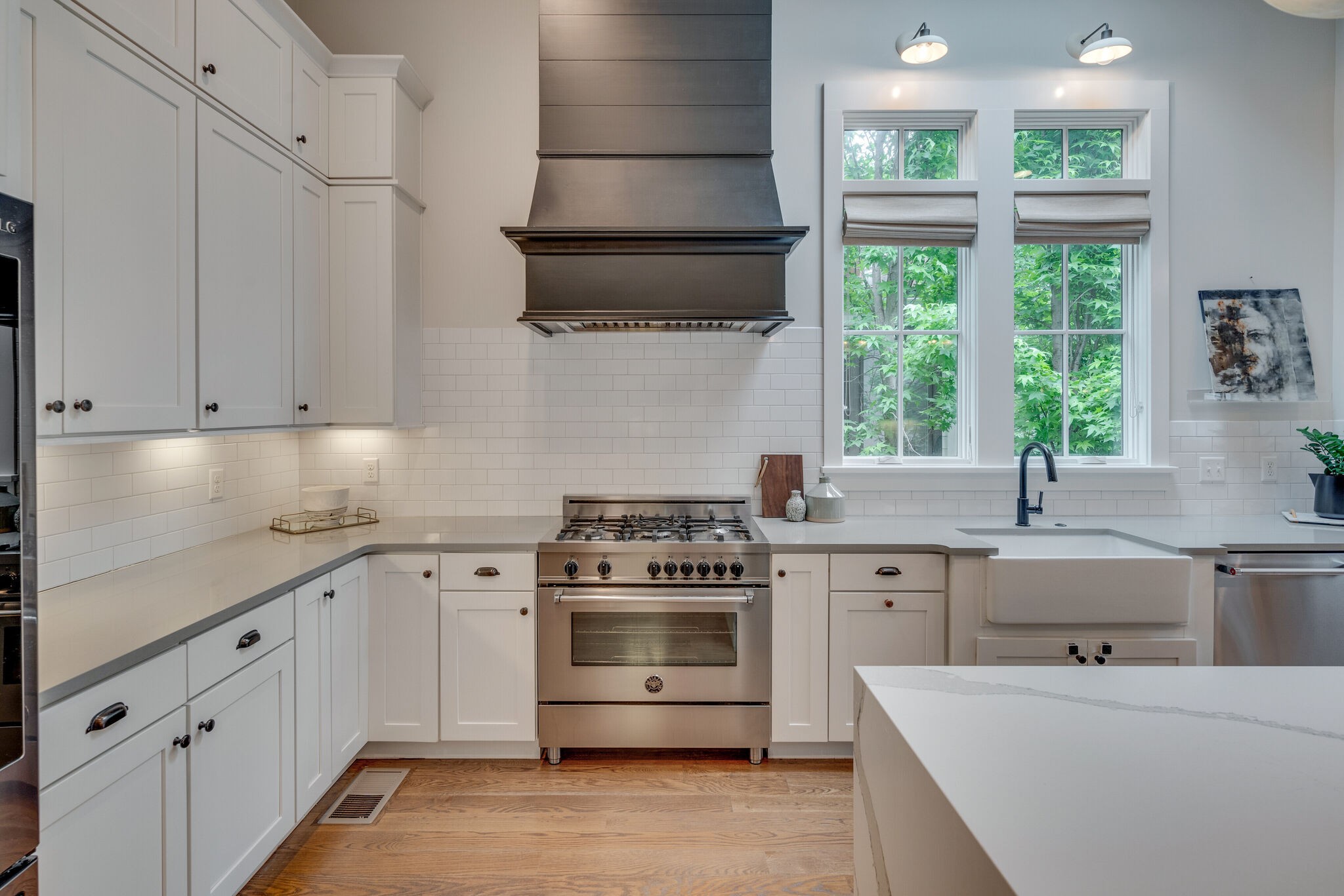 853 B Bradford Avenue Nashville, TN 37204 - Photo 13 of 49 a kitchen with cabinets appliances a sink and a window