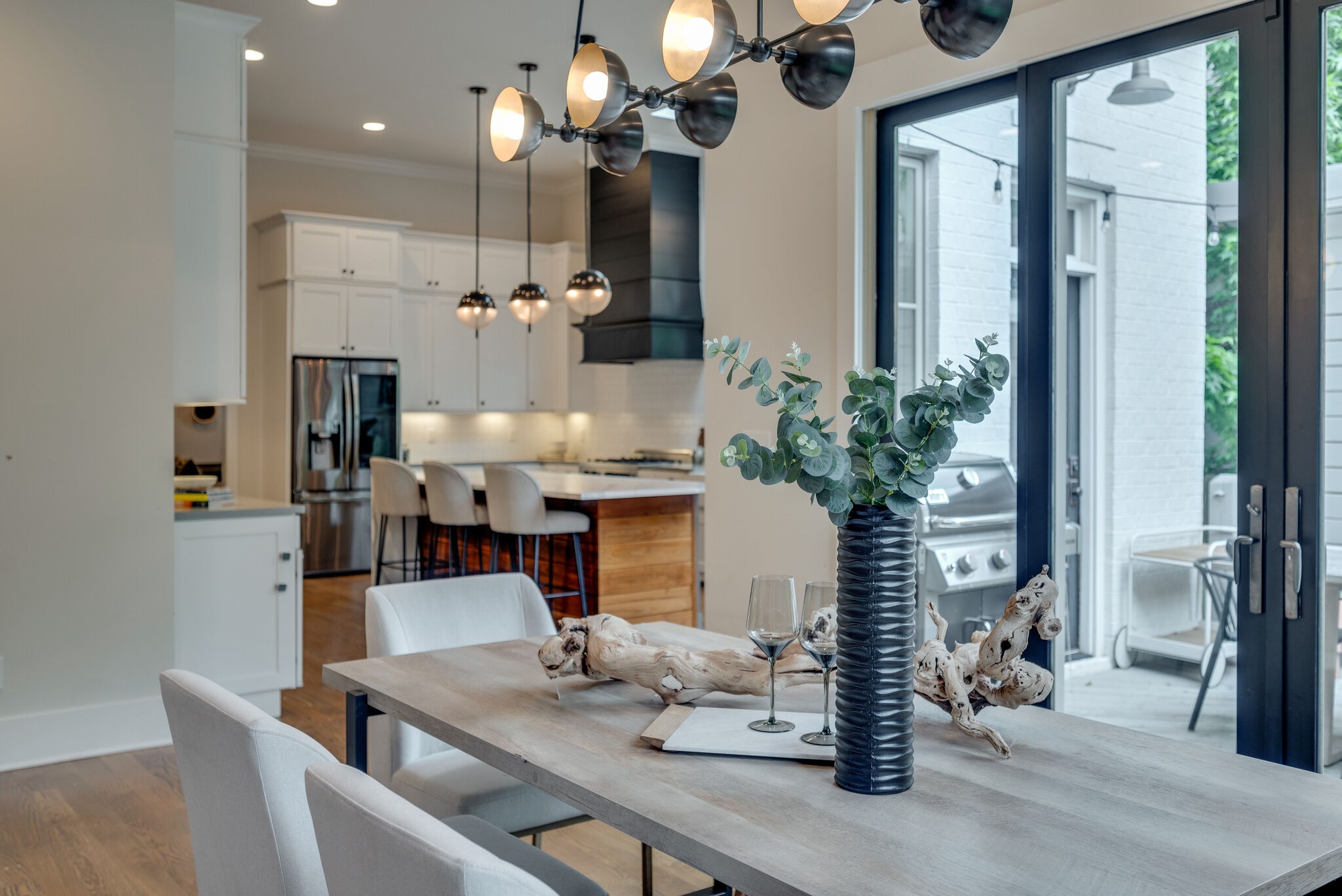 853 B Bradford Avenue Nashville, TN 37204 - Photo 17 of 49 a dining room with furniture and a chandelier