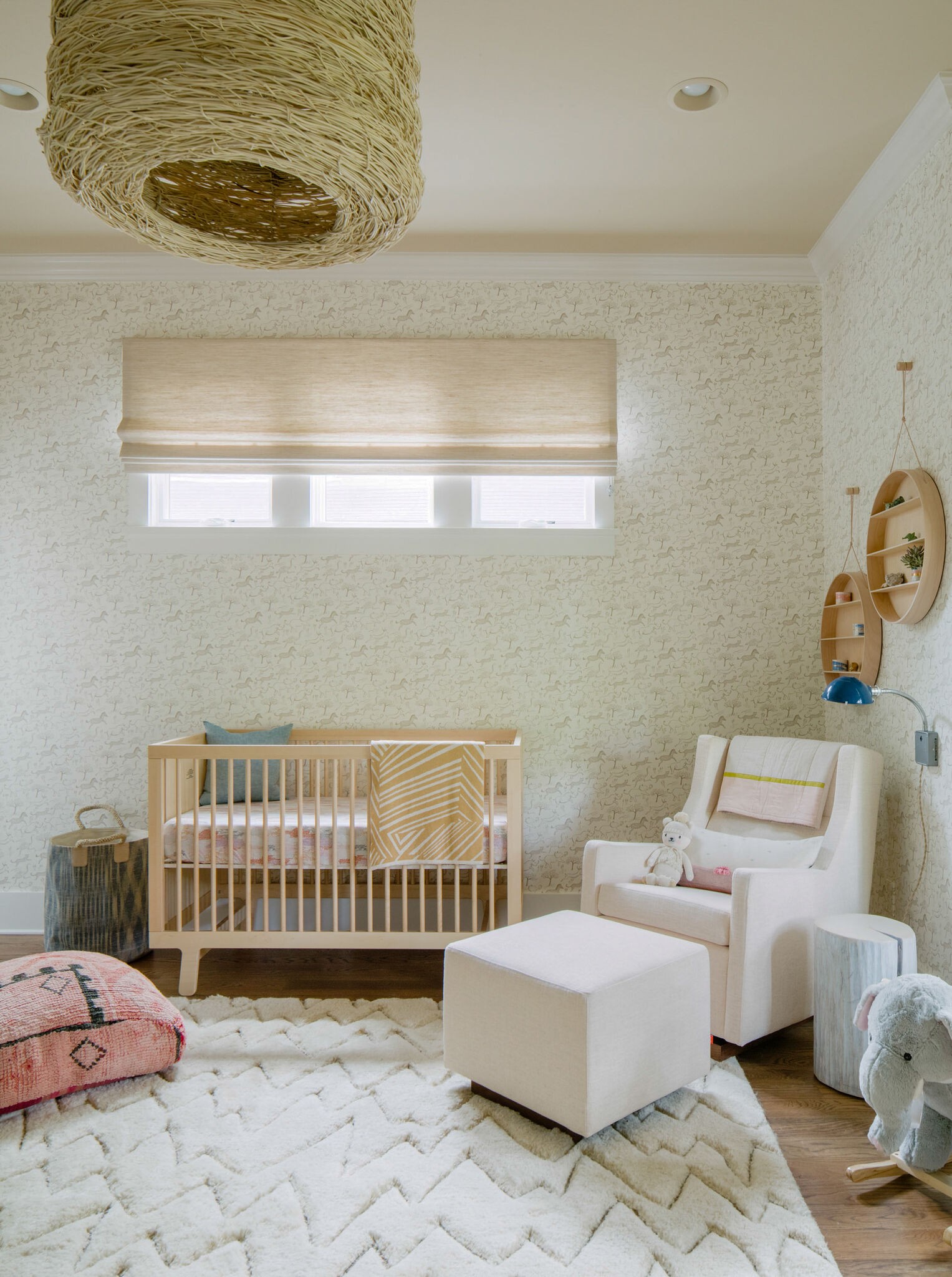 853 B Bradford Avenue Nashville, TN 37204 - Photo 26 of 49 a bedroom with a baby bed a couch and a window
