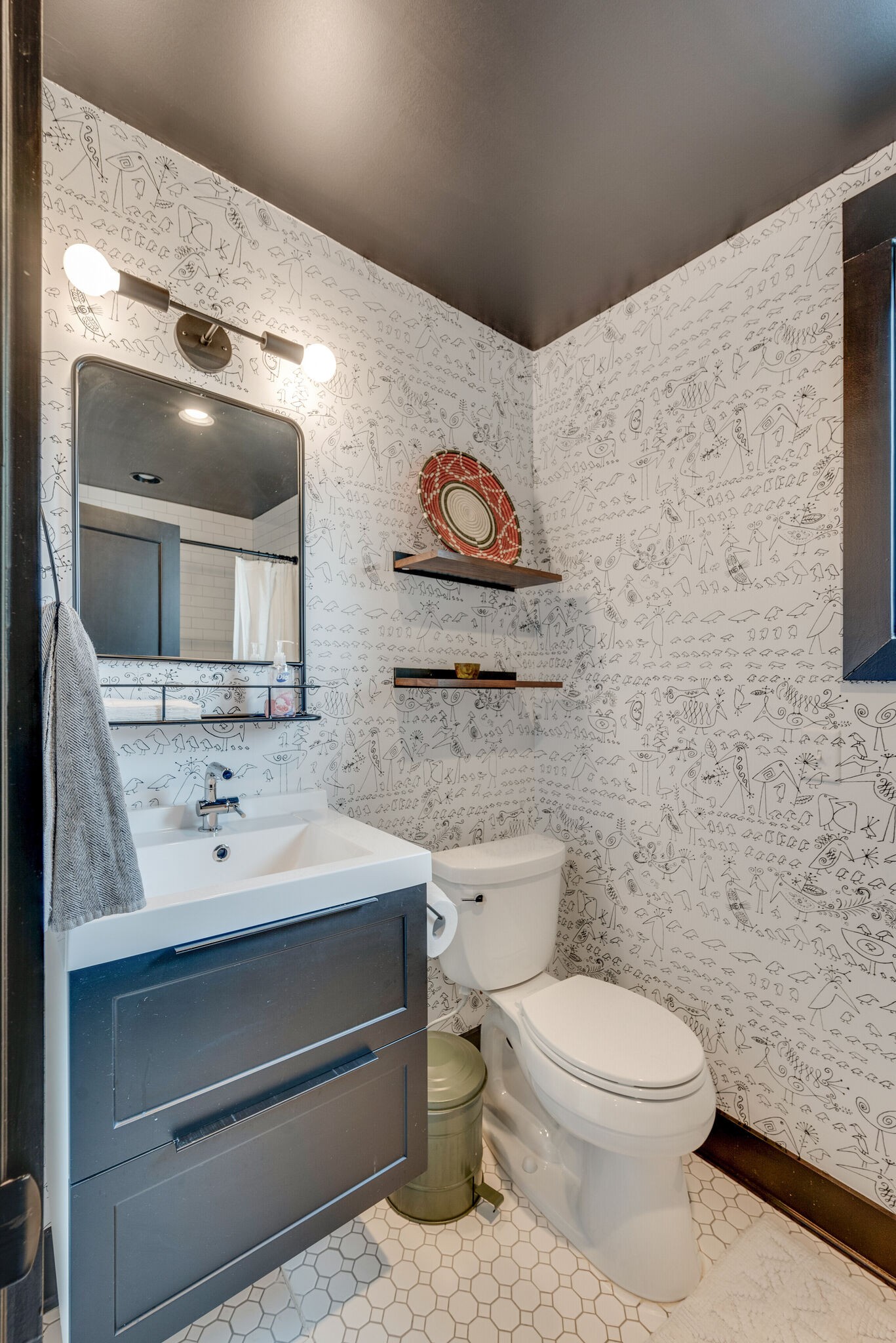 853 B Bradford Avenue Nashville, TN 37204 - Photo 45 of 49 a bathroom with a toilet sink and mirror