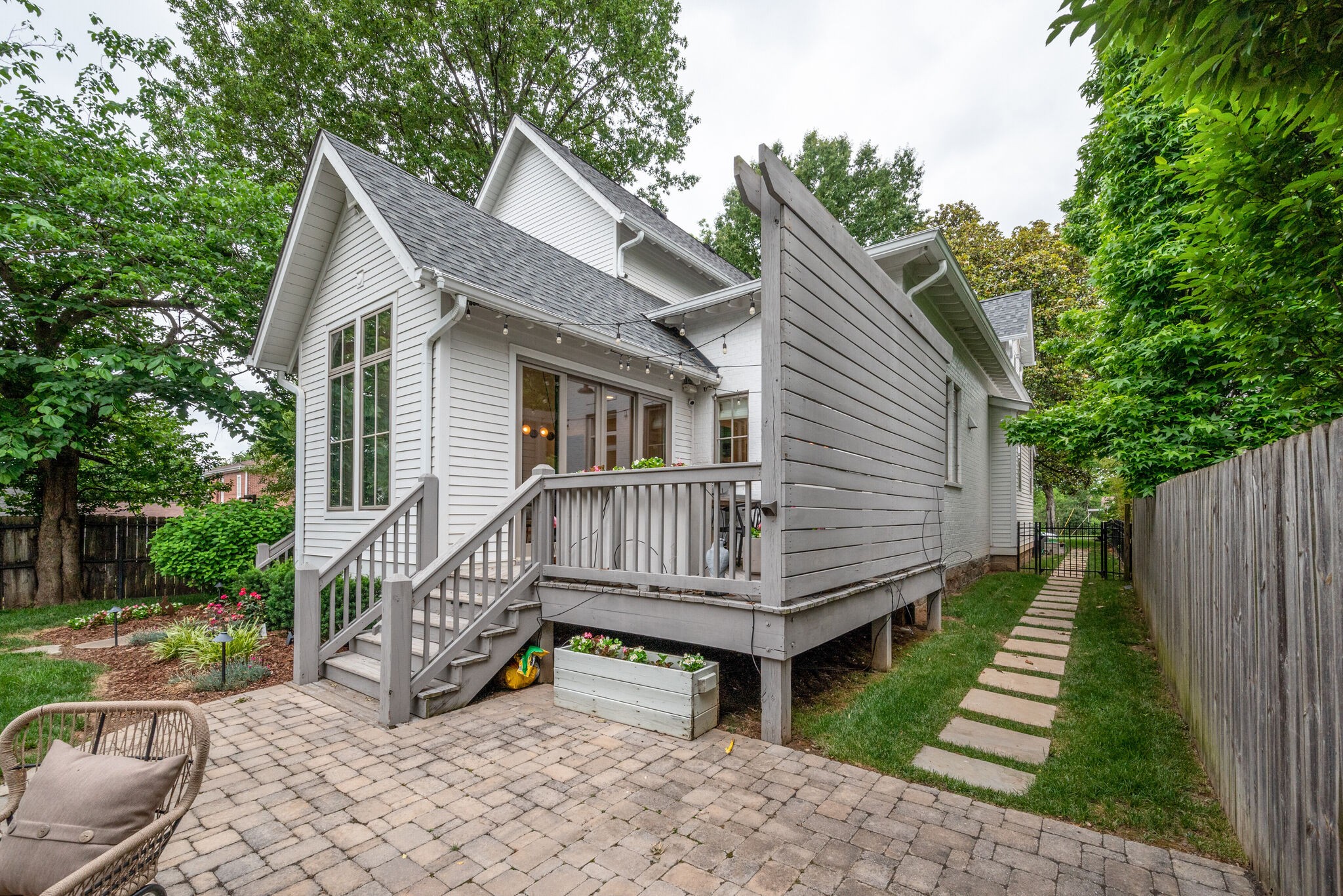 853 B Bradford Avenue Nashville, TN 37204 - Photo 48 of 49 a view of a house with wooden deck and furniture