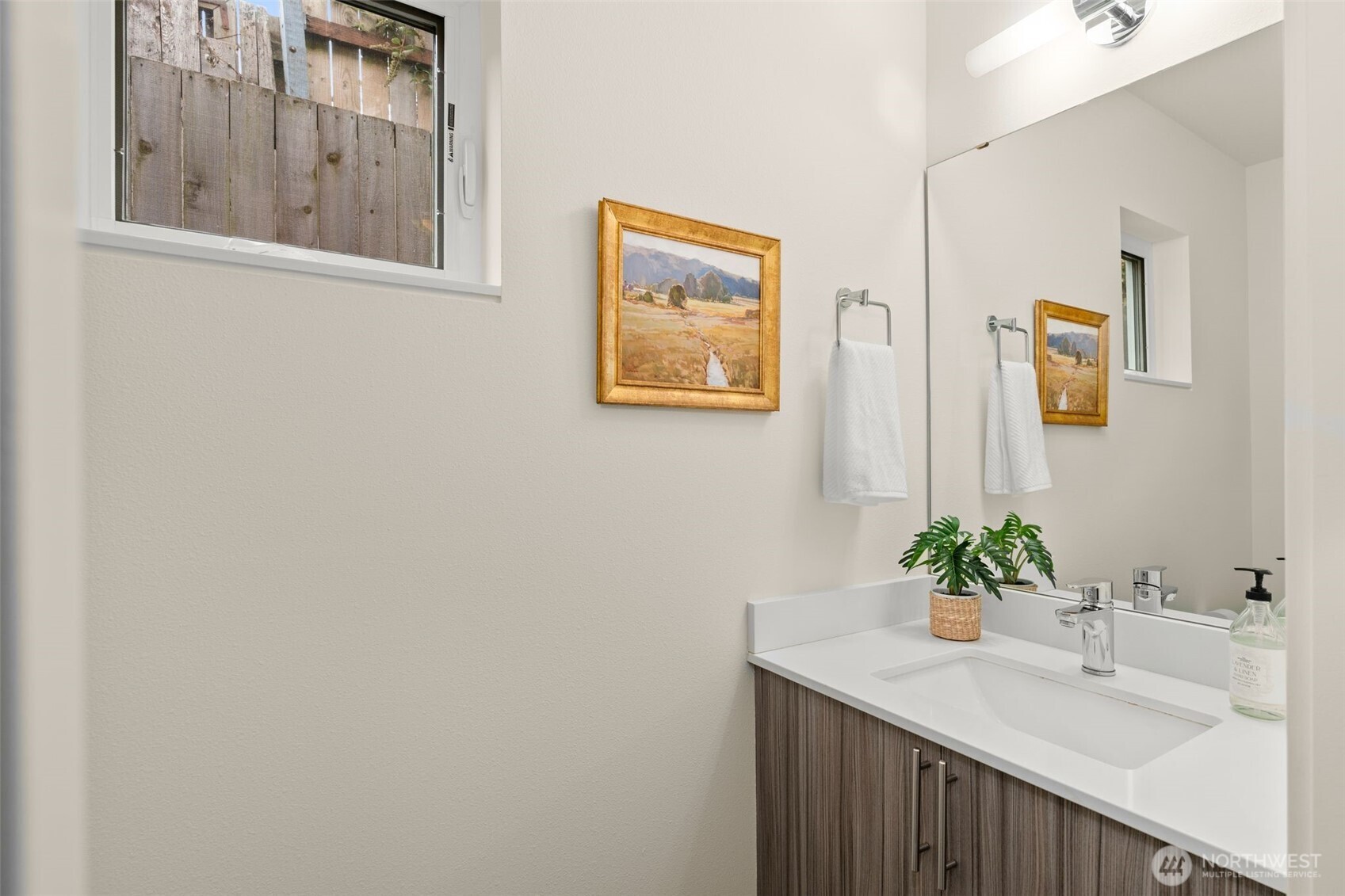 6012 South 127th Lane Seattle, WA 98178 - Photo 17 of 35 a bathroom with a sink and a mirror