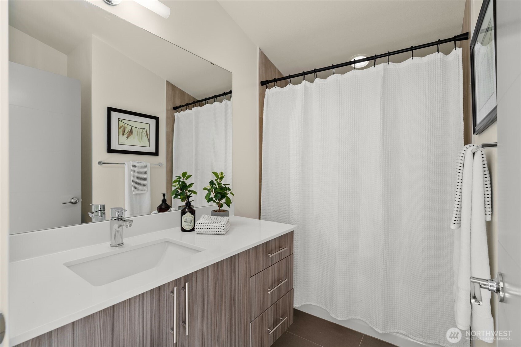 6012 South 127th Lane Seattle, WA 98178 - Photo 19 of 35 a bathroom with a sink and a mirror