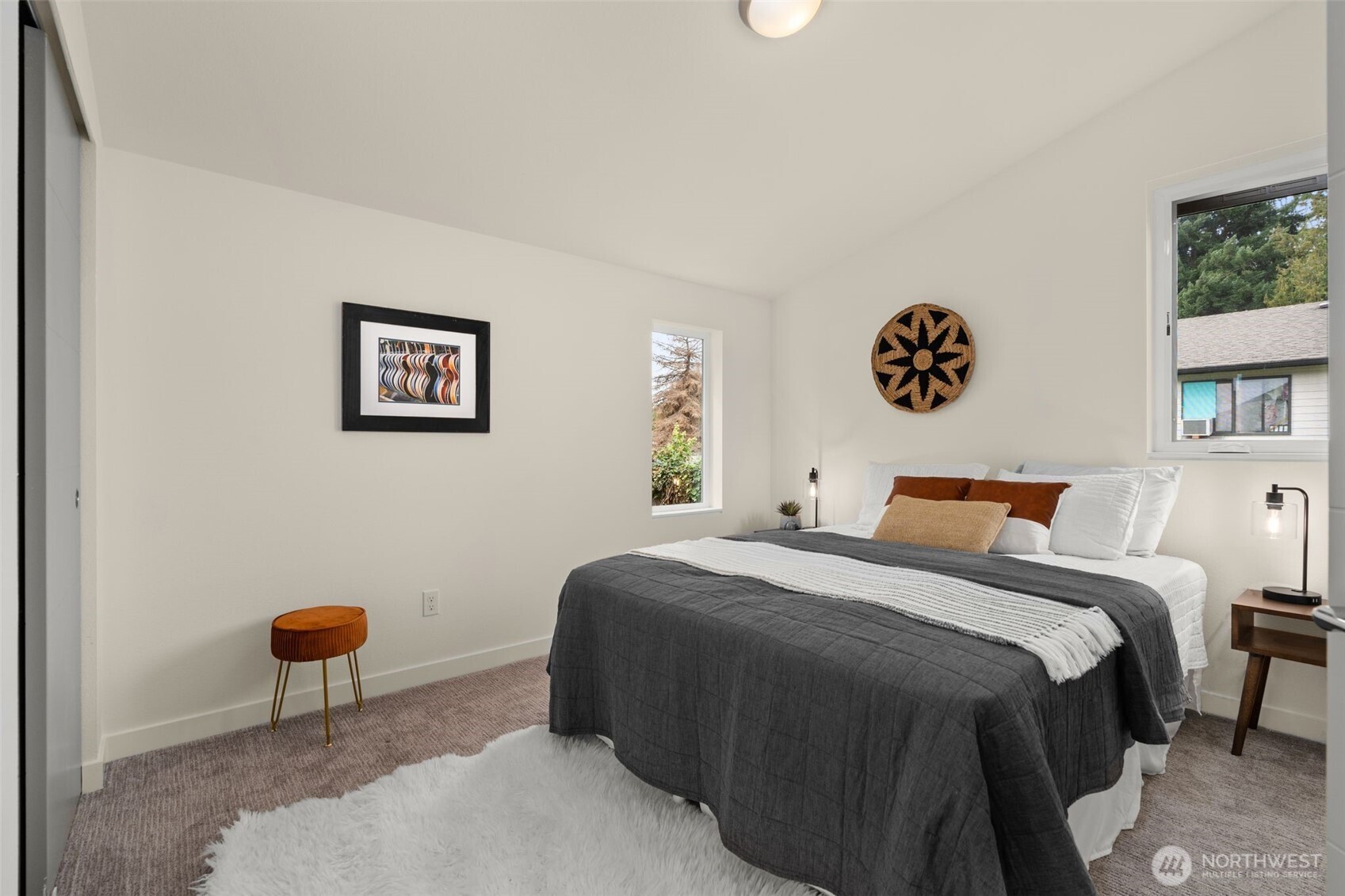 6012 South 127th Lane Seattle, WA 98178 - Photo 21 of 35 a bedroom with a bed and a painting on the wall