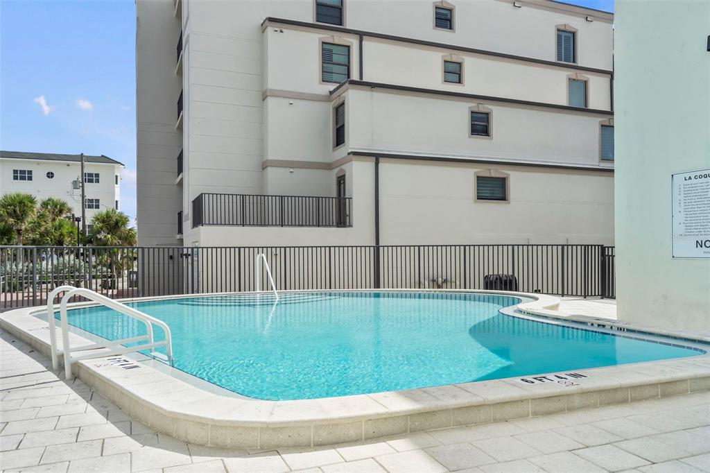 2810 North Beach Road, Unit 106 Englewood, FL 34223 - Photo 17 of 28 a view of swimming pool with seating space