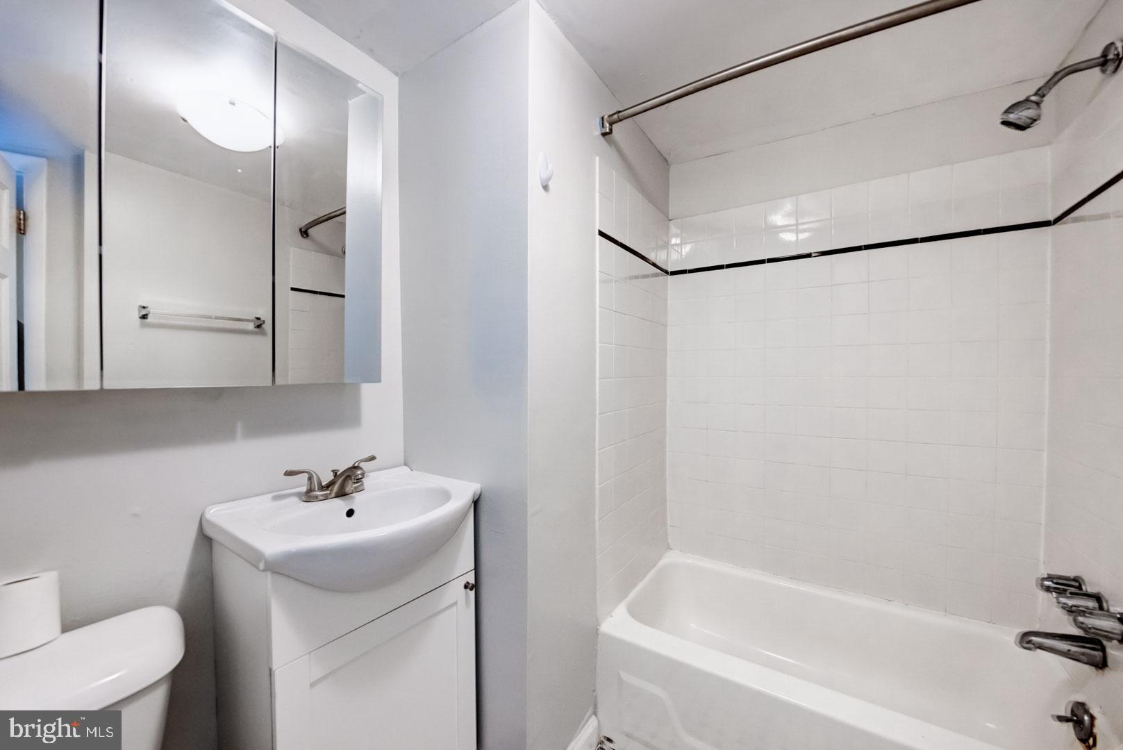 4442 Baker Street Philadelphia, PA 19127 - Photo 16 of 23 a bathroom with a sink toilet and shower
